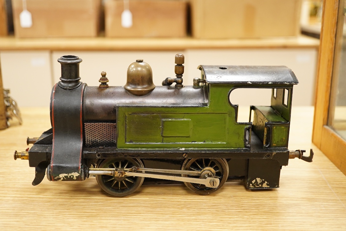 An early 20th century Gauge One Bing live steam 0-4-0T ‘I48’ locomotive, with a spirit fired pot boiler, driving a single oscillating vertical cylinder mounted in the cab, with twin outside dummy cylinders, the regulator